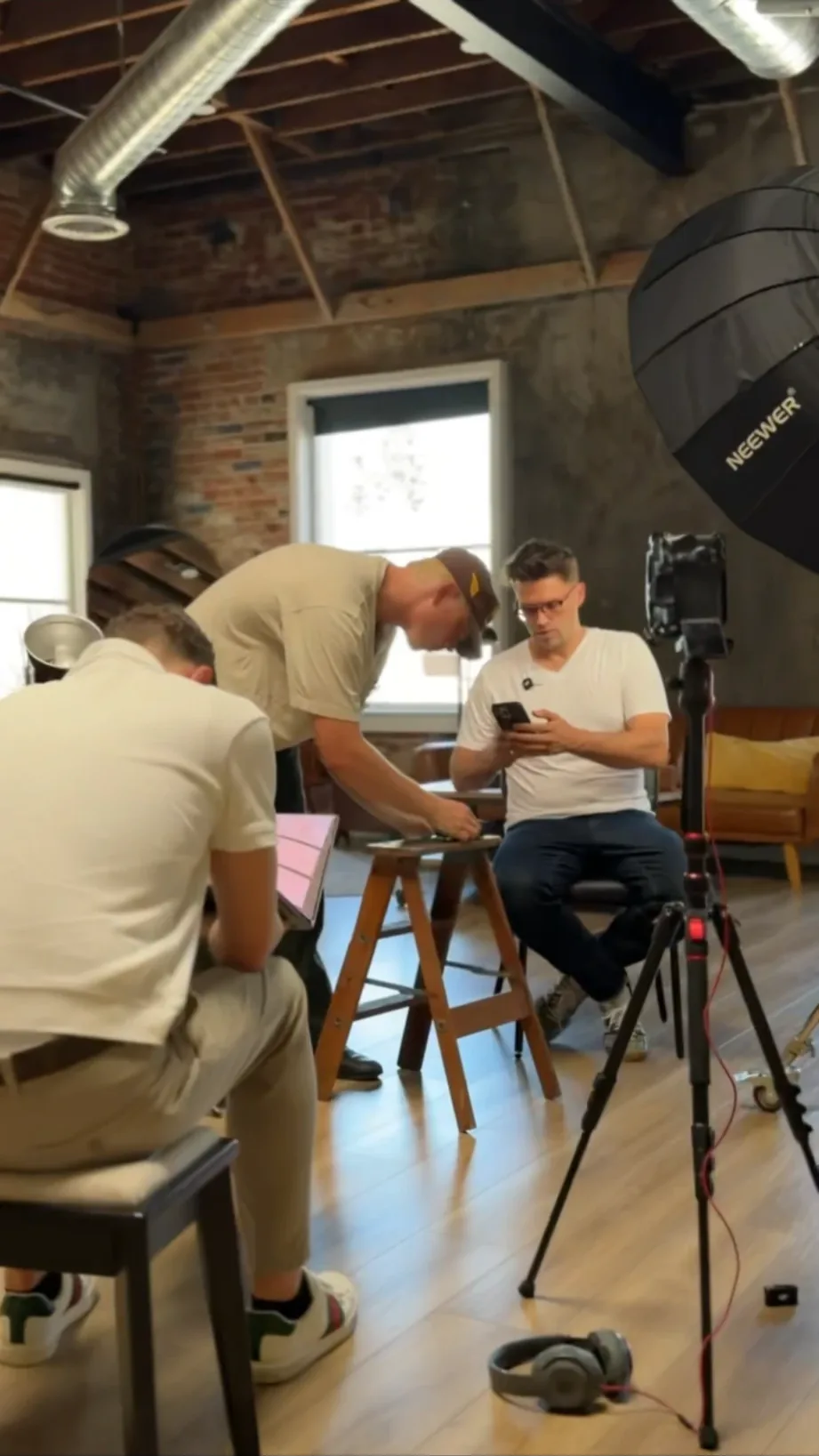 Crew setting up a podcast-style interview shoot