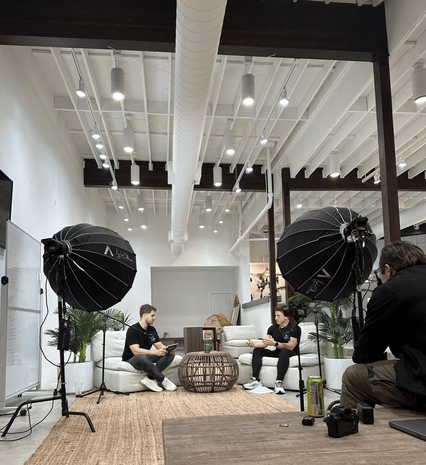 Long-form brand shoot in the Influenceish studio — two hosts on white couches between light domes